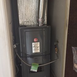Air-Right technician servicing a Ruud furnace